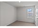 This bedroom is spacious with neutral colored walls and carpet at 429 Citron St, Sanford, NC 27332