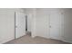 This bedroom features neutral carpet and a spacious closet at 429 Citron St, Sanford, NC 27332