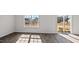 Bright living area featuring luxury vinyl plank flooring and large windows for natural light at 429 Citron St, Sanford, NC 27332