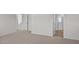 This is a primary bedroom with an ensuite bathroom and neutral carpet at 429 Citron St, Sanford, NC 27332