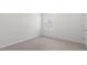 Bright bedroom with a large window and neutral carpet and walls at 433 Citron St, Sanford, NC 27332