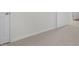Clean bedroom showcasing neutral carpet and trim, with doors adding depth at 433 Citron St, Sanford, NC 27332