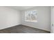 Cozy bedroom featuring natural light, hardwood floors, and neutral walls at 433 Citron St, Sanford, NC 27332
