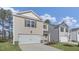 Charming two-story home features a one-car garage, neutral siding, and manicured landscaping at 433 Citron St, Sanford, NC 27332
