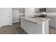 Modern kitchen featuring stainless appliances, gray cabinets, stone countertops, and a large island at 433 Citron St, Sanford, NC 27332