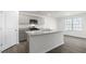 Modern kitchen with stainless appliances, gray cabinetry, granite countertops, and a large island at 433 Citron St, Sanford, NC 27332