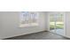 Bright living room featuring large windows and sliding glass door access at 433 Citron St, Sanford, NC 27332