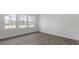 Bright living room with hardwood flooring and expansive windows at 433 Citron St, Sanford, NC 27332