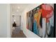 Hallway features wood floors, abstract art, and lighting at 437 Citron St, Sanford, NC 27332
