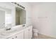 Bathroom featuring a double sink vanity, a mirror and access to shower at 4913 Sugargrove Ct, Apex, NC 27539