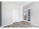 Bedroom with hardwood floors, french doors and a closet, offering ample space and natural light at 4913 Sugargrove Ct, Apex, NC 27539