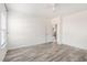 This bedroom features hardwood floors, neutral walls, and a ceiling fan at 4913 Sugargrove Ct, Apex, NC 27539