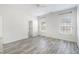 This spacious bedroom has hardwood floors, a ceiling fan and two large windows at 4913 Sugargrove Ct, Apex, NC 27539