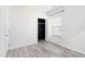 Bright bedroom with hardwood floors, a large window, and closet at 4913 Sugargrove Ct, Apex, NC 27539