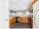 Modern kitchen with stainless steel appliances, wooden cabinets, and ample countertop space at 4913 Sugargrove Ct, Apex, NC 27539