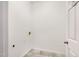 This laundry room has tile floors and connections for washer and dryer at 4913 Sugargrove Ct, Apex, NC 27539