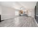 An open concept living room with a view of the kitchen featuring a large, open space at 4913 Sugargrove Ct, Apex, NC 27539