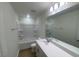 A bathroom with shower and bath, modern sink and a big mirror at 544 John Stark Dr, Fuquay Varina, NC 27526