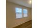 Sunlit bedroom features large windows and hardwood floors, offering a bright and airy feel at 544 John Stark Dr, Fuquay Varina, NC 27526