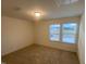A comfy bedroom with multiple windows allowing for natural light at 544 John Stark Dr, Fuquay Varina, NC 27526