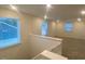 Carpeted upstairs area featuring multiple windows for natural light and spacious living at 544 John Stark Dr, Fuquay Varina, NC 27526