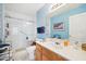 Clean bathroom featuring a glass-enclosed shower and a single sink vanity with ample counter space at 5548 Roan Mountain Pl, Raleigh, NC 27613