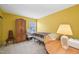 Bedroom featuring yellow walls, a small bed and window at 5548 Roan Mountain Pl, Raleigh, NC 27613