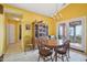Cozy dining room with classic furniture, elegant lighting, and a warm ambiance at 5548 Roan Mountain Pl, Raleigh, NC 27613