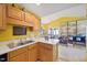 Open kitchen with backyard views, seamlessly connected to the dining and living areas at 5548 Roan Mountain Pl, Raleigh, NC 27613