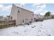 Fenced backyard with a well-maintained lawn and patio perfect for outdoor entertaining at 5627 Quitman Trl, Raleigh, NC 27610