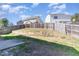 Fenced backyard with a small retaining wall, offering a secure space at 5627 Quitman Trl, Raleigh, NC 27610