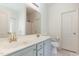 Clean bathroom with double sinks, modern fixtures, and a large mirror at 5627 Quitman Trl, Raleigh, NC 27610