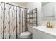 Bright bathroom featuring a white sink and vanity, and a decorative shower curtain at 5627 Quitman Trl, Raleigh, NC 27610