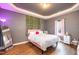 Cozy bedroom features stylish decor, pink accents, and unique wall vines at 5627 Quitman Trl, Raleigh, NC 27610