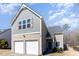 Charming two-story home with a two-car garage and well-maintained front lawn at 5627 Quitman Trl, Raleigh, NC 27610