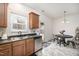 Bright eat-in kitchen featuring stainless steel appliances and a dining area with table and chairs at 5627 Quitman Trl, Raleigh, NC 27610