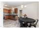 Eat-in kitchen with stainless steel appliances, wood cabinets, and a view to the backyard at 5627 Quitman Trl, Raleigh, NC 27610