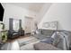Bright living room with high ceilings, a large gray sofa, and stylish decor at 5627 Quitman Trl, Raleigh, NC 27610