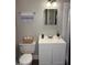 Updated bathroom featuring a modern sink, neutral color palette, and ceramic tile flooring at 613 Sexton Ave, Zebulon, NC 27597