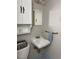 Well-lit bathroom featuring modern fixtures, sink vanity, and ceramic tile flooring at 613 Sexton Ave, Zebulon, NC 27597