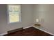 Cozy bedroom with a window and a hardwood floor, plus side table with lamp for a warm ambiance at 613 Sexton Ave, Zebulon, NC 27597