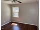 This bedroom is well-lit with hardwood floors and neutral walls, ideal for creating a peaceful retreat at 613 Sexton Ave, Zebulon, NC 27597