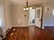 Cozy dining area with laminate flooring, modern lighting, and a view of the backyard at 613 Sexton Ave, Zebulon, NC 27597