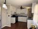 Traditional kitchen with white cabinets, dark countertops, and modern appliances at 613 Sexton Ave, Zebulon, NC 27597
