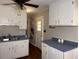 Classic kitchen design with ample cabinet space, dark countertops, and updated appliances at 613 Sexton Ave, Zebulon, NC 27597
