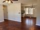 Open living room flows into the dining room with a hardwood floor and natural light at 613 Sexton Ave, Zebulon, NC 27597