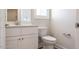 Powder room featuring a white vanity, a toilet, and neutral wall color at 6935 Old Jefferson Hwy, Cameron, NC 28326