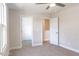 Carpeted bedroom featuring access to the closet and upstairs hallway at 6935 Old Jefferson Hwy, Cameron, NC 28326