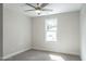 This is a bedroom with a ceiling fan and a single window at 6935 Old Jefferson Hwy, Cameron, NC 28326