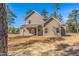 Home exterior featuring backyard, covered patio, and side door at 6935 Old Jefferson Hwy, Cameron, NC 28326